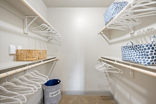 plenty of closet space in the laundry room at the enclave at woodbridge apartments in sugar land