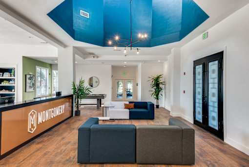 A Montgomery office lobby with a blue ceiling and a black door.