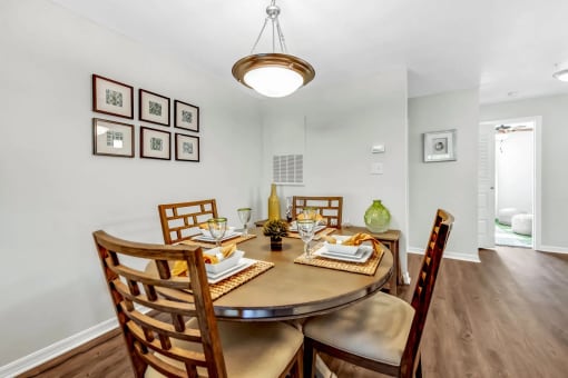 a dining room with a table and chairs
