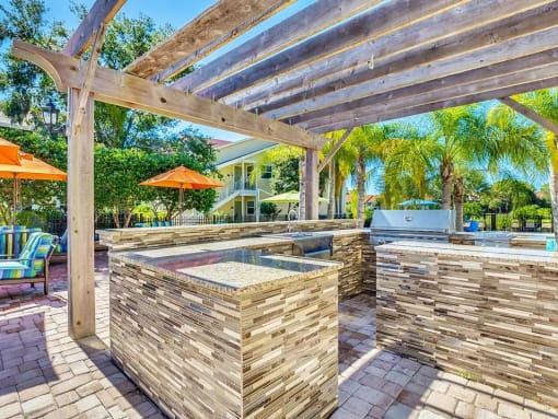 a backyard with a hot tub and a pergola