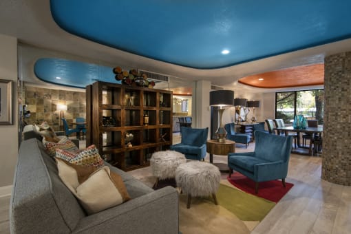 a living room filled with furniture and a large window