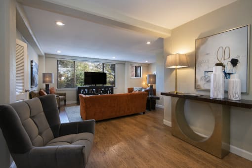 a living room filled with furniture and a flat screen tv