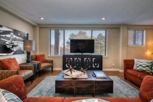 a living room with couches and a coffee table