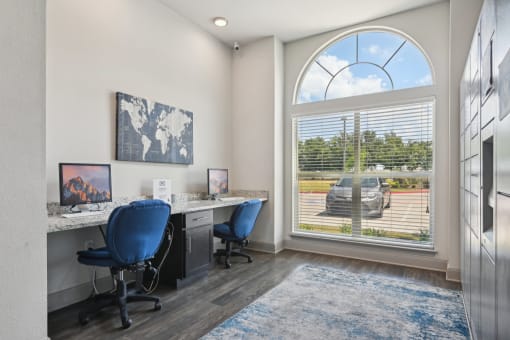 a office with a large window and a desk with two chairs