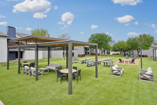a rendering of a picnic area with tables and chairs on the grass