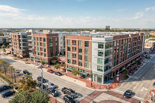 A street view of a city with cars and buildings.