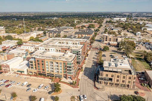 A city street with cars and buildings.
