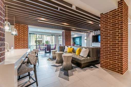 A modern clubroom with plenty of seating.