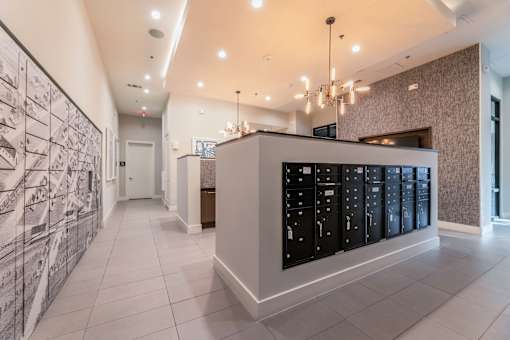 A centralized mail room with chandeliers.