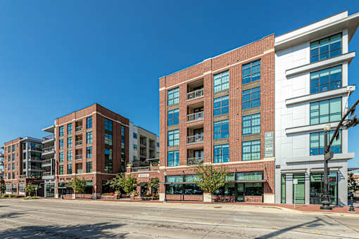 A large building with a lot of windows is in the foreground.