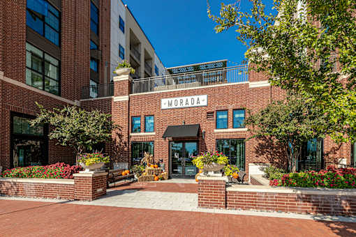 The front of a leasing office in Plano, Texas with a sign that says Morada.