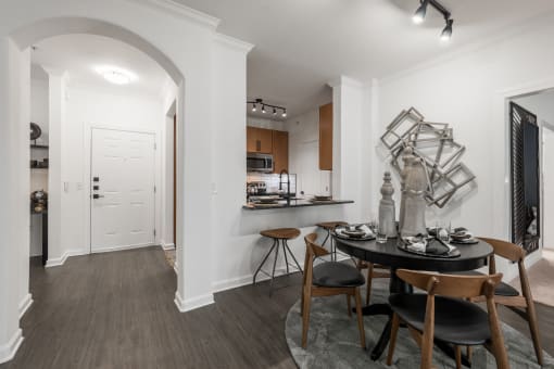 a kitchen and dining area in a 555 waverly unit