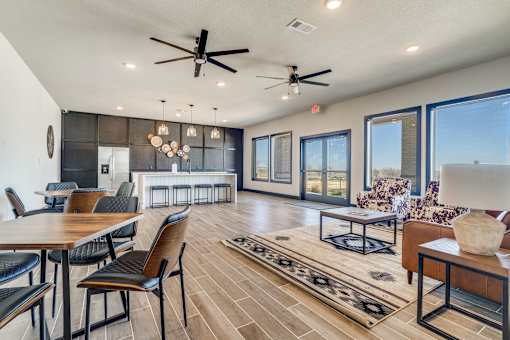 A modern living room with a dining table and chairs.