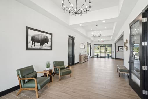 a long hallway with chairs and a large picture of a bull