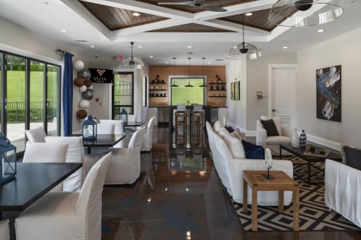 a living room filled with furniture and a large window