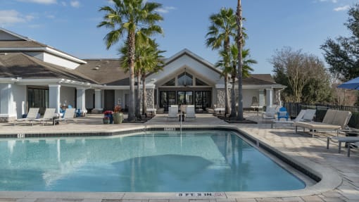 a house with a swimming pool in front of it