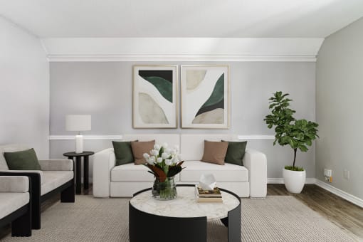 a living room with a white couch and a coffee table