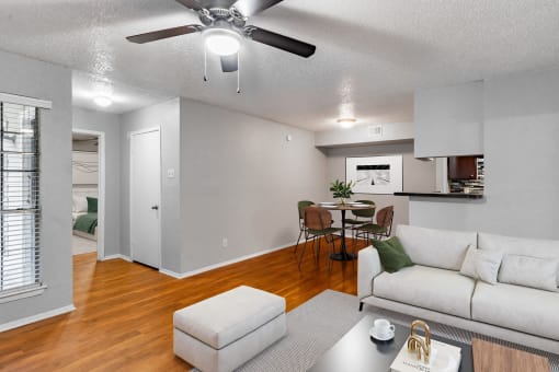 an open living room and dining room with a couch and a table