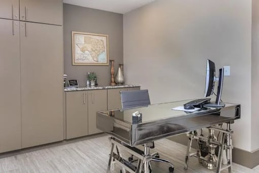 A room with a desk and a chair.