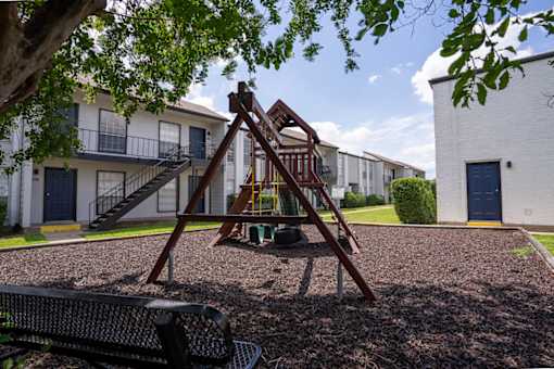 A playground with swing set.