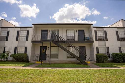 A white two-story apartment building