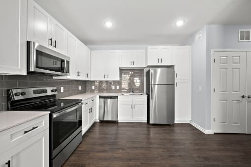 Modern kitchen with stainless steel appliances1 at The Aurea Apartments, Houston, TX