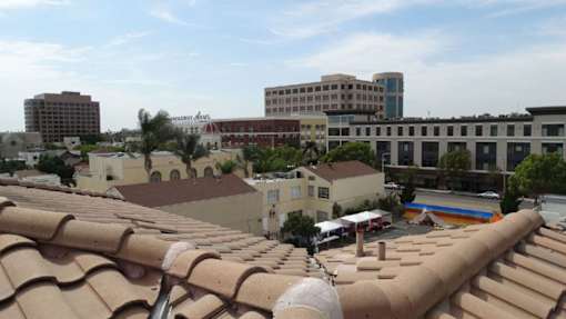 A view of a cityscape with buildings and rooftops.