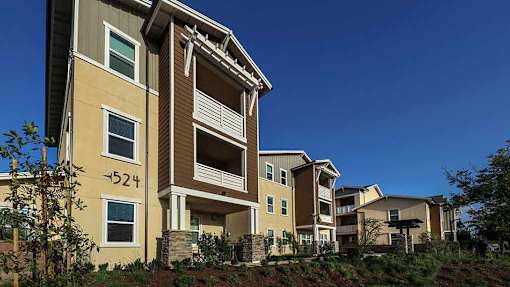 Apartment building number 524 with a clear blue sky in the background.