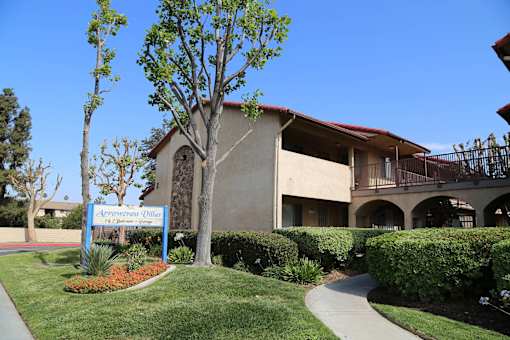 A building with a sign that says "Academy of Woodland".