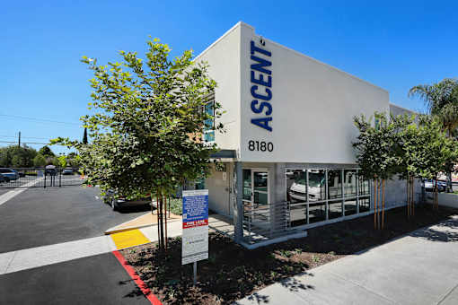 A white building with the word "ASCENT" on it.