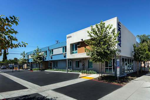 A modern building with the name "ASCOWC" on the side.