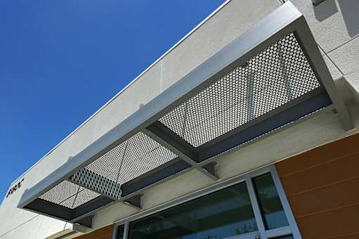 A building has a large air vent on the side.