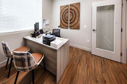 A room with a desk and chair.