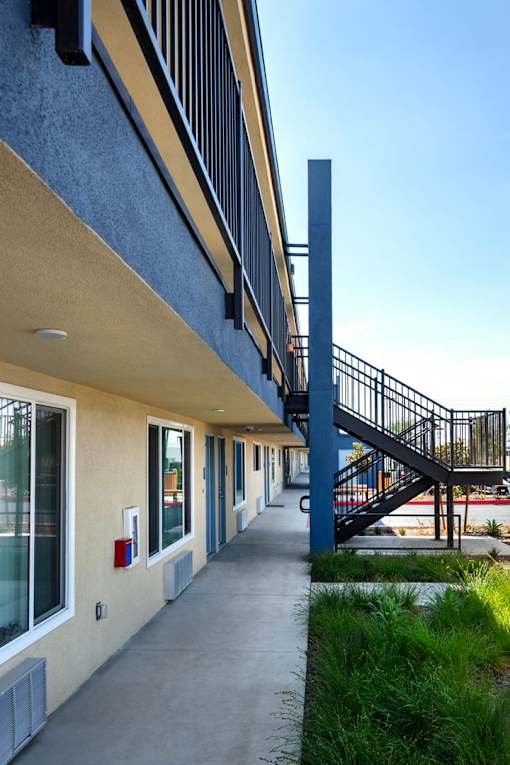 A long hallway with a staircase on the right side.