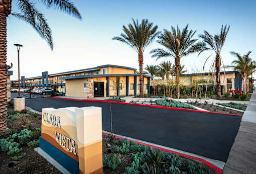 A building with a sign that says Clara Vista in front of it.