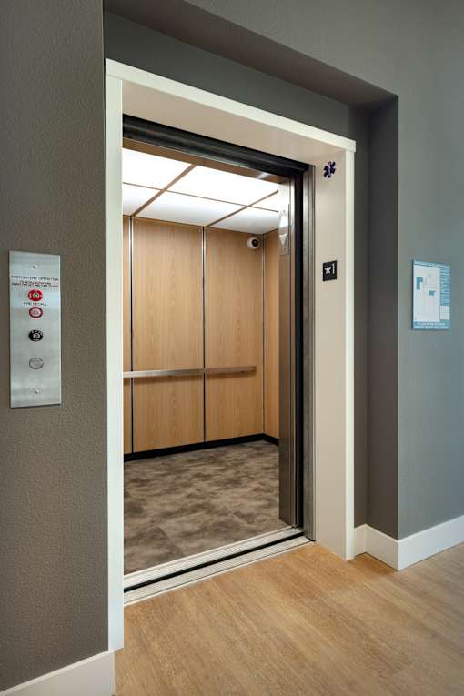 A door with a sign on the wall next to it.