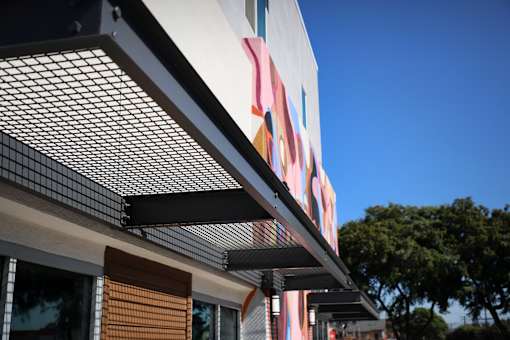 A building with a colorful mural on the side.