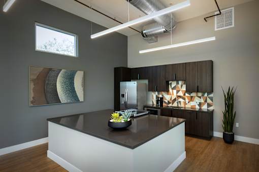 A modern kitchen with a large island in the middle.