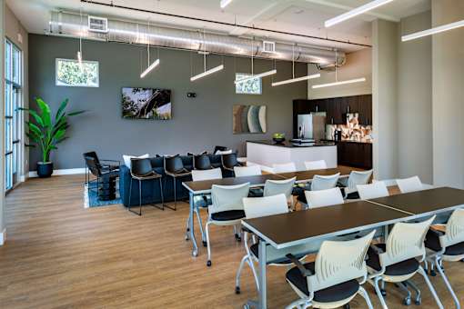 A conference room with a long table and chairs.