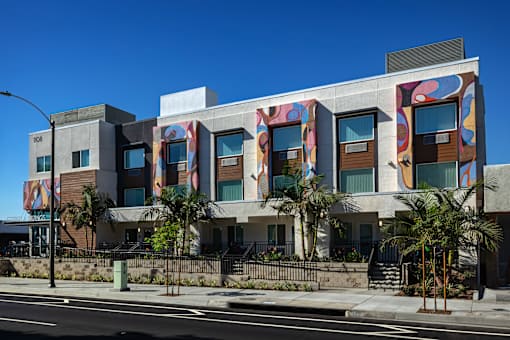 A modern building with a colorful mural on the side.