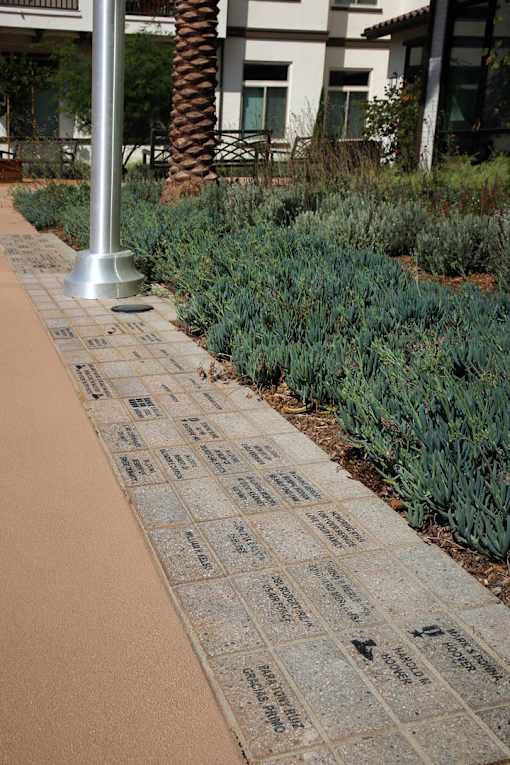 A walkway with a plaque on it.