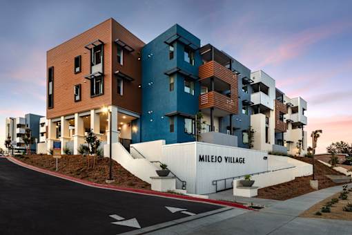 A modern apartment complex named Milejo Village is shown.