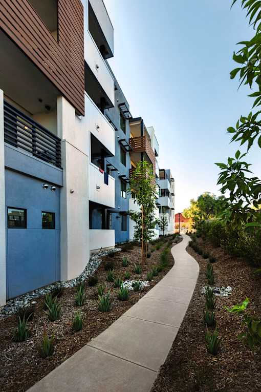 A modern building with a walkway in front of it.