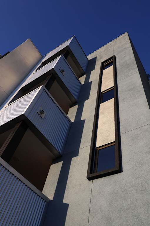 A modern building with a blue sky in the background.