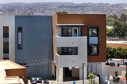 A modern building with a view of the city in the background.