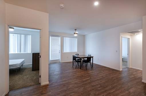 A room with a table and chairs in it.
