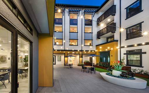 A modern building with a courtyard and a fountain.