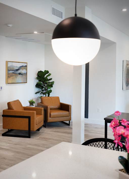 Two chairs and a table in a room.