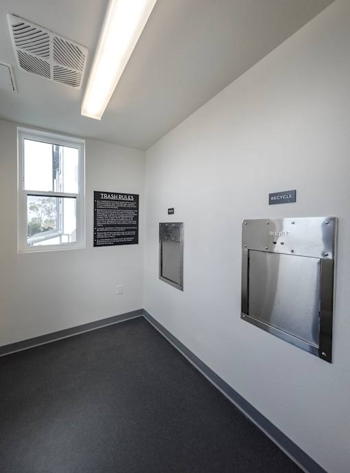 A room with a sign that says "TRANSPORTATION" and a door with a sign that says "MOTORCYCLE".