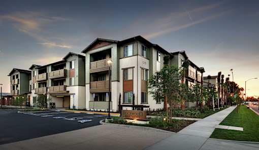 Apartment complex with a street in front.